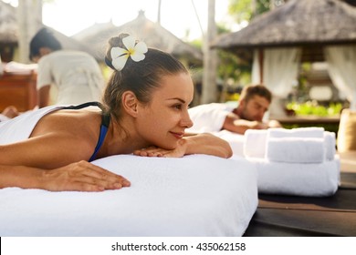 Romantic Couple Spa. Closeup Of Beautiful Healthy Happy Smiling Woman, Handsome Man Relaxing At Day Spa Resort. People Enjoying Body Relaxation Massage Outdoors In Summer. Relax Treatment Concept - Powered by Shutterstock