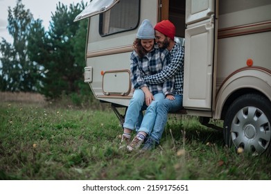 Romantic Couple Spending Time Together Near Trailer Home.