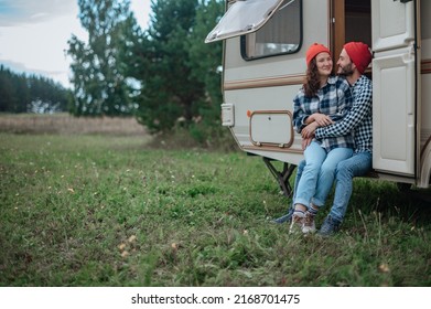 Romantic Couple Spending Time Together Near Trailer Home. 