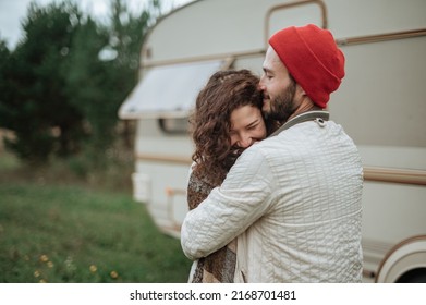 Romantic Couple Spending Time Together Near Trailer Home. 