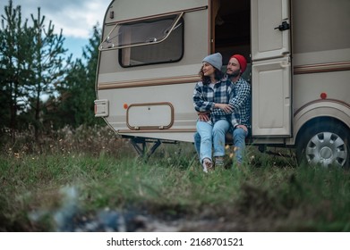 Romantic Couple Spending Time Together Near Trailer Home. 