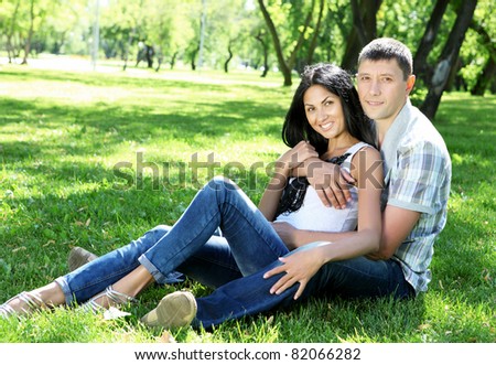 Romantic couple spending time together in the summer park