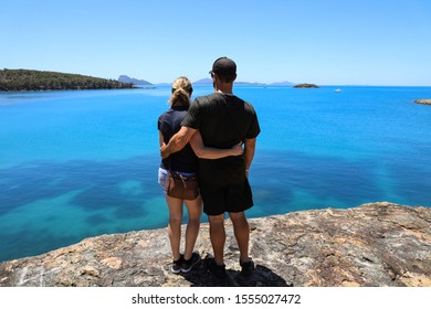 Romantic Couple Standing Looking At The Ocean At Hamilton Island