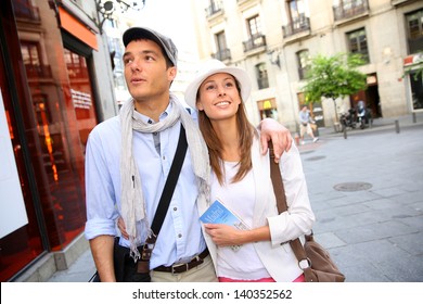 Romantic Couple Walking In The Streets Of Madrid, Spain