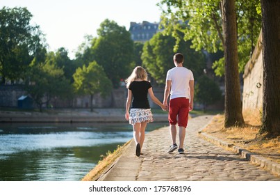 Romantic Couple Walking Together Near The Seine