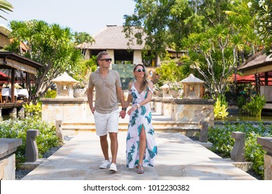 Romantic Couple Walking In Tropical Resort