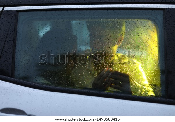 Romantic couples\
inside a car for\
photoshoot