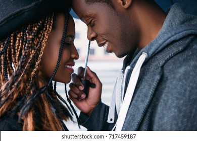 Romantic date. African American love couple. Happy relationship, smiling black people on rainy day, happiness concept