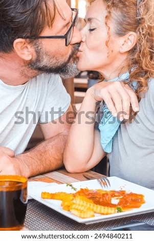 Similar – Image, Stock Photo Woman kissing man from side in sunset