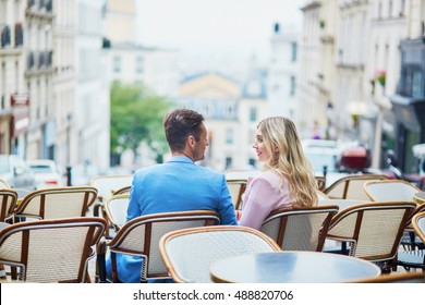 Romantic Dating Couple In Cozy Outdoor Cafe On Montmartre, Paris, France