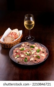 Romantic Dinner With Carpaccio Cold Meats Basket Of Artisan Breads Glass Of White Wine Caper, Portrait