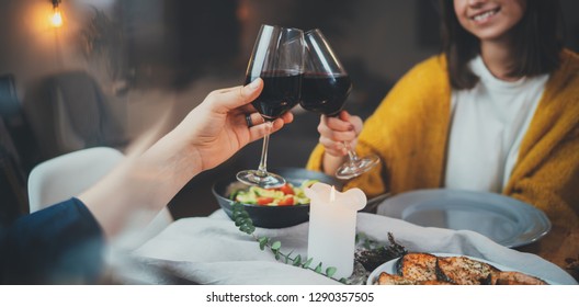 Romantic dinner concept, cropped image of happy couple enjoying healthy food and red wine during romantic dinner by candlelight, Celebration Love Relationship Date Concept