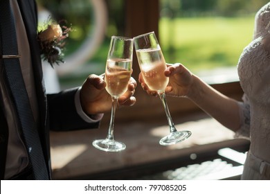 Romantic Dinner Or Date With Champagne Glasses. Toast And Clinking With Alcoholic Drinks. Celebration On Wedding Party. Marriage Concept