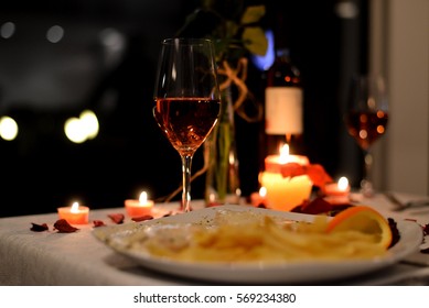 Romantic Dinner With Food And Vine Setting