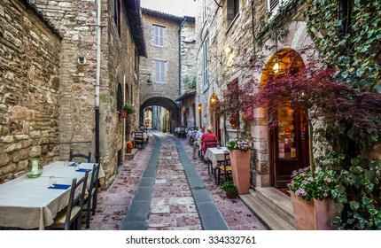 Romantic dinner place in a beautiful alley in the ancient town of Assisi, Umbria, Italy