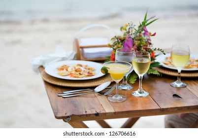 Romantic Dinner Served For Two On A Beach