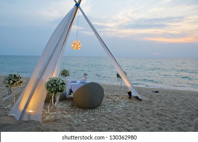 Romantic Dinner Set Up On The Beach