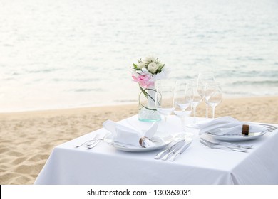 Romantic Dinner Set Up On The Beach