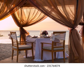 Romantic Dinner Setting On The Beach