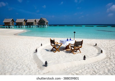 Romantic Dinner Setup On Maldivian Beach