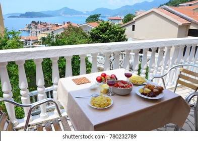 Romantic Dinner Table In Montenegro.  Tasty Fresh Food Near Blue Sea