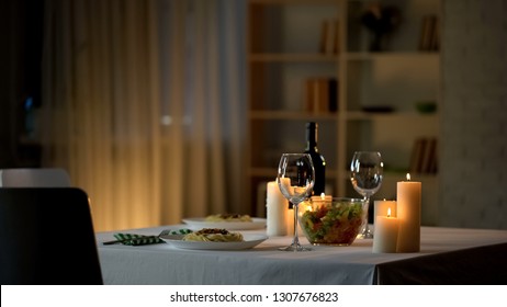 Romantic Dinner Table Setting, Wine Glasses And Fresh Salad In Bowl, Home Date