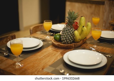 Romantic dinner table setup with fresh fruit