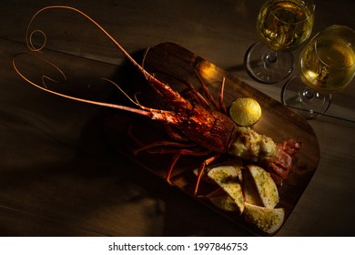 Romantic Dinner For Two. Red Lobster With Croutons And Sauce And Two Glass Of White Wine On Wooden Surface With Copy Space