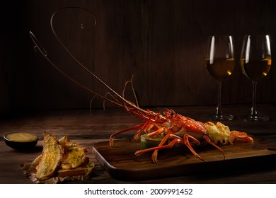 Romantic Dinner For Two. Red Lobster With Croutons And Sauce And Two Glass Of White Wine On Wooden Surface With Copy Space