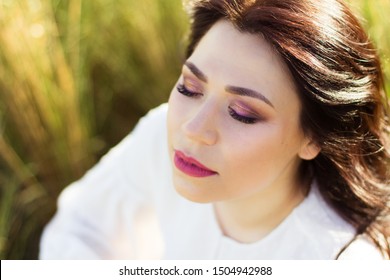 Romantic and dreaming woman with beautiful makeup in nature - Shutterstock ID 1504942988