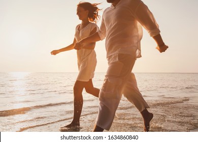 Romantic Getaway Travel, Happy Couple On The Beach Having Fun, Honeymoon Tourists On Summer Holidays