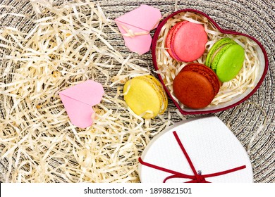 A Romantic Gift. French Macaron Macaroon In A Heart Shaped Box. Valentine's Day Flat Lay