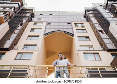 Romantic Happy Couple Relax And Have Fun At Balcony In Their New Home Apartment