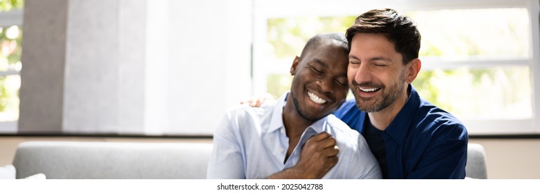 Romantic Happy Gay Couple Relaxing On Couch
