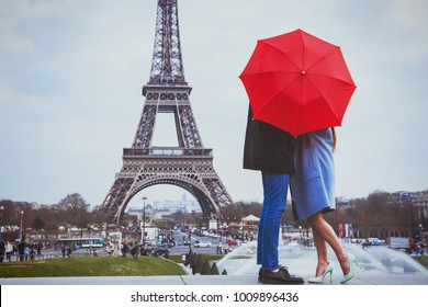 romantic holidays for couple in Paris, honeymoon vacation in France, Europe, man and woman kissing near Eiffel tower