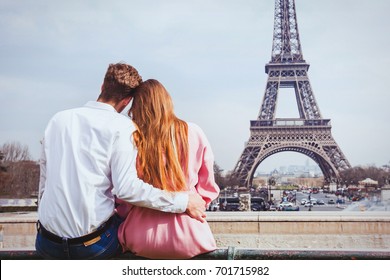 romantic holidays in France, couple sitting together near Eiffel tower in Paris, honeymoon travel