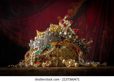 Romantic image of a treasure chest filled with jewellery, precious gems and golden king's crowns - Shutterstock ID 2137360471