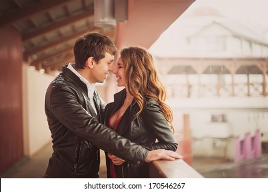 Romantic kiss of two lovers in the city / Young happy couple