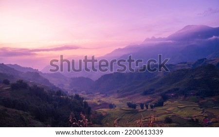 Romantic landscape sunset foggy mountain in evening twilight. Beautiful landscape foggy hills twilight time. Beautiful Purple sky sunrise dramatic landscape mountain. Dawn sky dusk time cloudscape