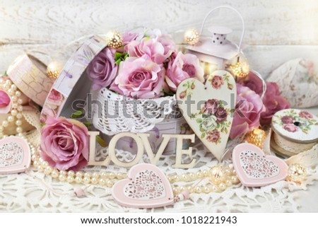 romantic love decoration with hearts,roses and lanterns in shabby chic style for wedding or valentine`s day