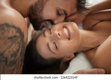 Romantic love of young couple in the bedroom.