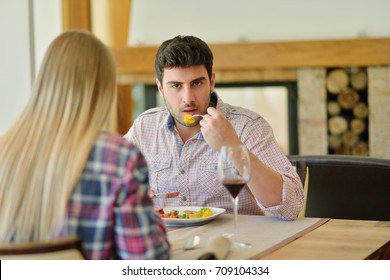 Romantic Lunch In A Fancy Restaurant.couple Sitting And Eating At Lunch Time