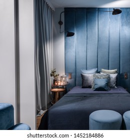 Romantic And Luxury, Blue Bedroom With Wall Panels And Double Bed Behind Sliding Doors