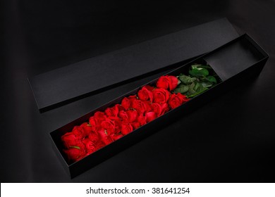 Romantic luxury red roses in gift souvenir black box, place the logo on a black studio background, spring is coming, 8 March  - Powered by Shutterstock