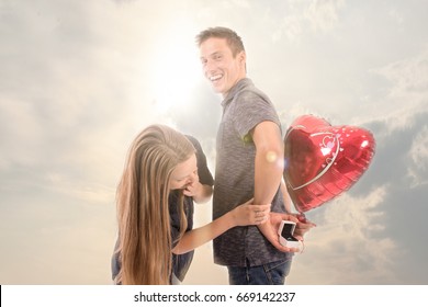romantic man proposing to a woman