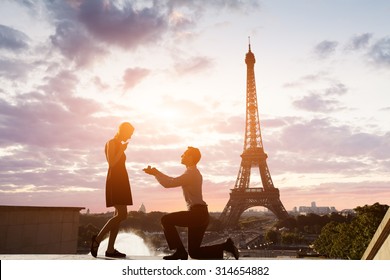 Romantic marriage proposal at Eiffel Tower, Paris, France - Powered by Shutterstock