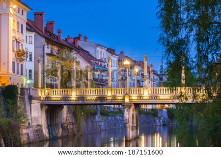 Romantic medieval Ljubljana's city center, capital of Slovenia, Europe. Gallus bank of river Ljubljanica with Cobblers' Bridge or the Shoemakers' Bridge ( ?evljarski or Ã?Â uÃ?Â¡tarski most ) shot at dusk. Stock photo © 