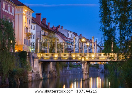 Romantic medieval Ljubljana's city center, the capital of Slovenia, Europe. Gallus bank of river Ljubljanica with Cobblers' Bridge or the Shoemakers' Bridge shot at dusk. Stock photo © 