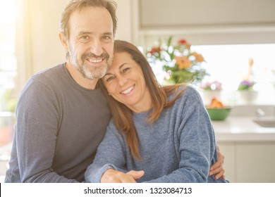 Romantic middle age couple sitting together at home - Powered by Shutterstock