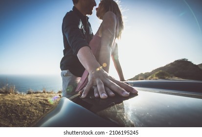 Romantic Moment On The Cliff In Malibu. Couple Watching Panorama From Their Car